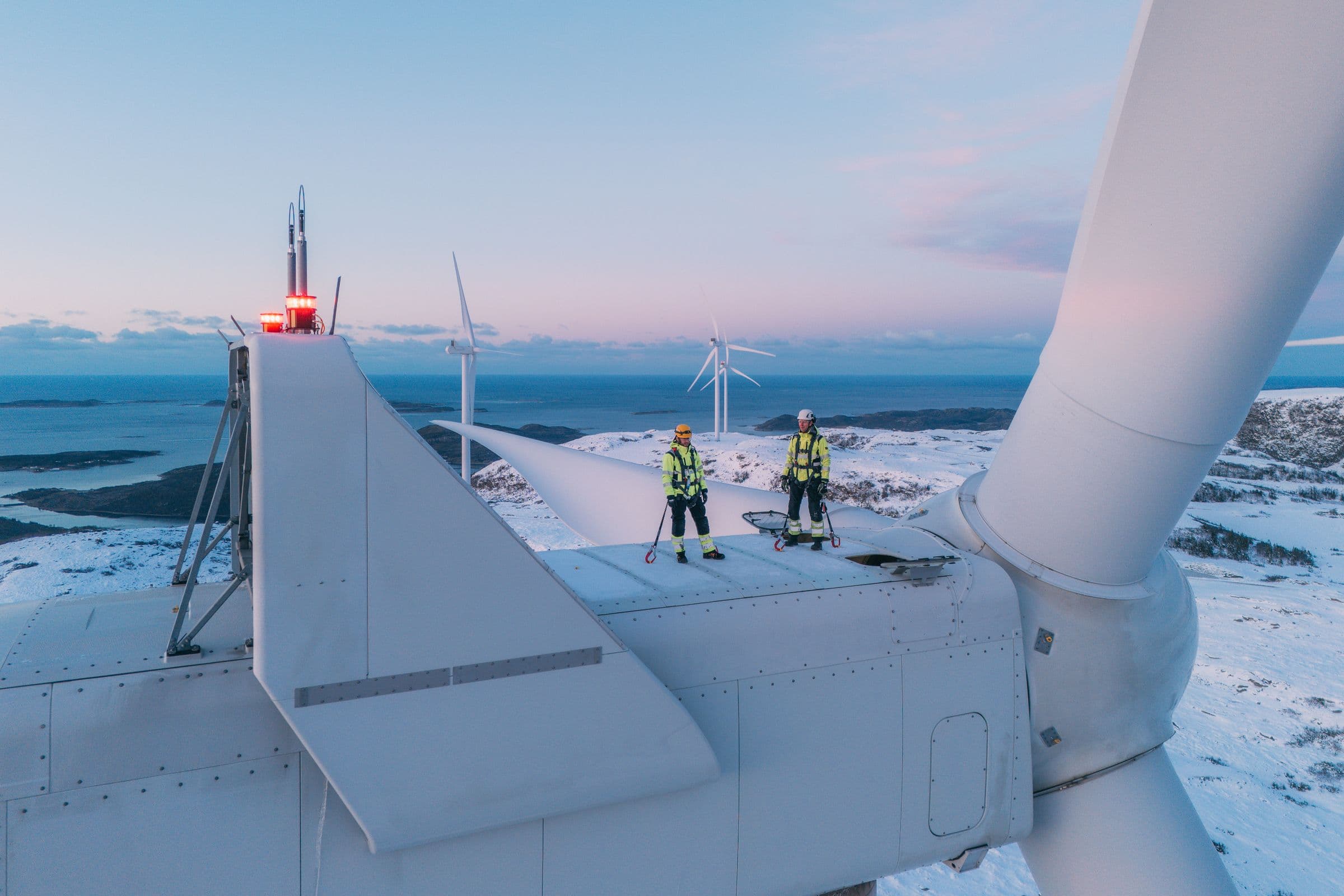 Workers on a wind turbine at Roan wind farm.